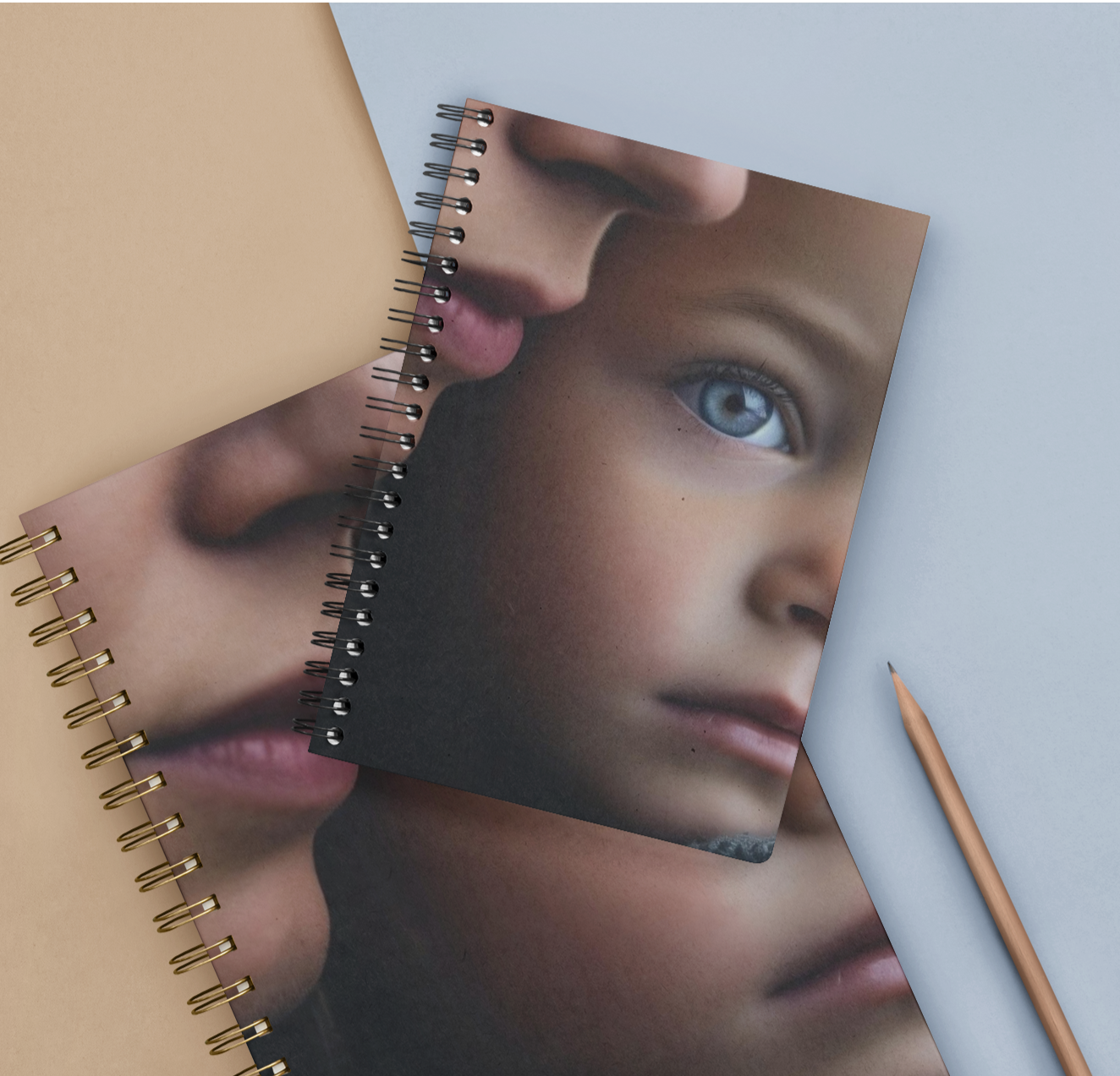 Two notebooks with a mother close to her daugher.