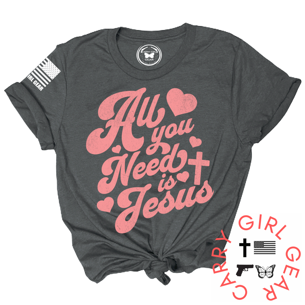 Gray t-shirt with pink text 'All you need is Jesus' on a white background